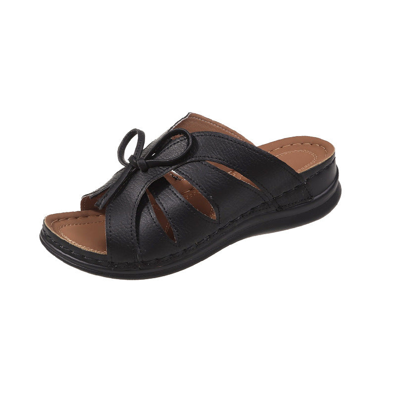 Chaussons à talons compensés plats avec nœud ajouré